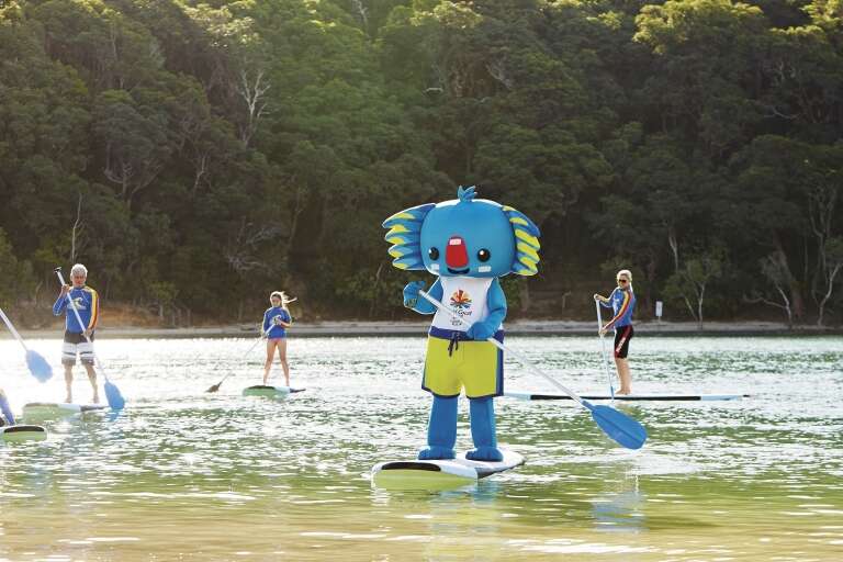 Mascot of the Gold Coast 2018 Commonwealth Games stand-up paddle baoarding, Gold Coast, Queensland © Tourism Australia