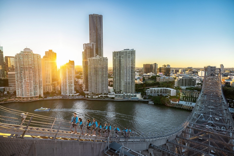 People climbing Brisbane's Story Bridge at sunset, Brisbane, Queensland © Tourism Australia