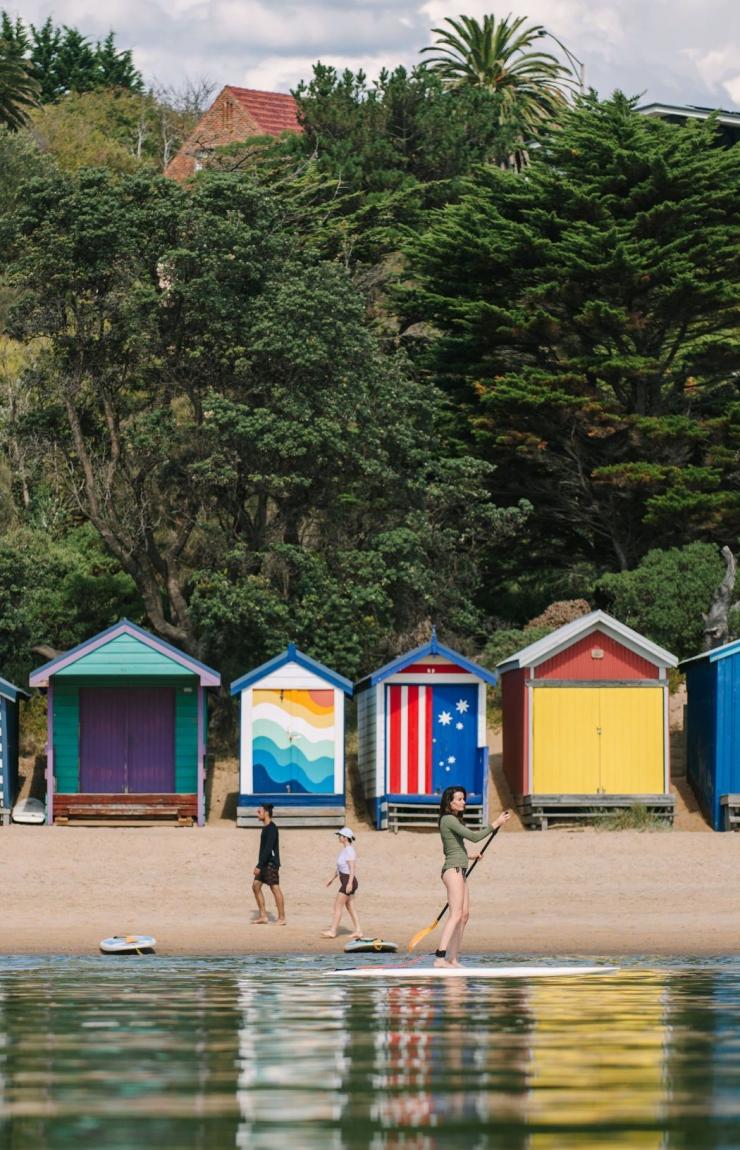 Colourful bathing boxes on the sandy foreshore of Mornington Peninsula, Victoria © Tourism Australia