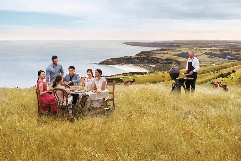 Group dining with a view overlooking the ocean, Kangaroo Island, South Australia © Tourism Australia