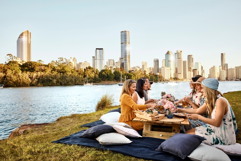 Friends having a picnic by the Brisbane River at Kangaroo Point, Brisbane, Queensland © Brisbane Marketing