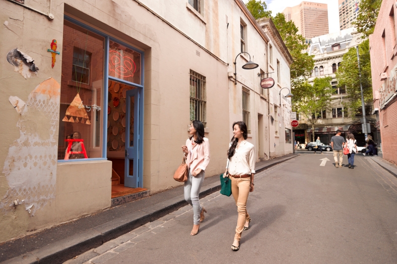 Two woman walking down a laneway in Crossley Street, Melbourne, Victoria © Visit Victoria