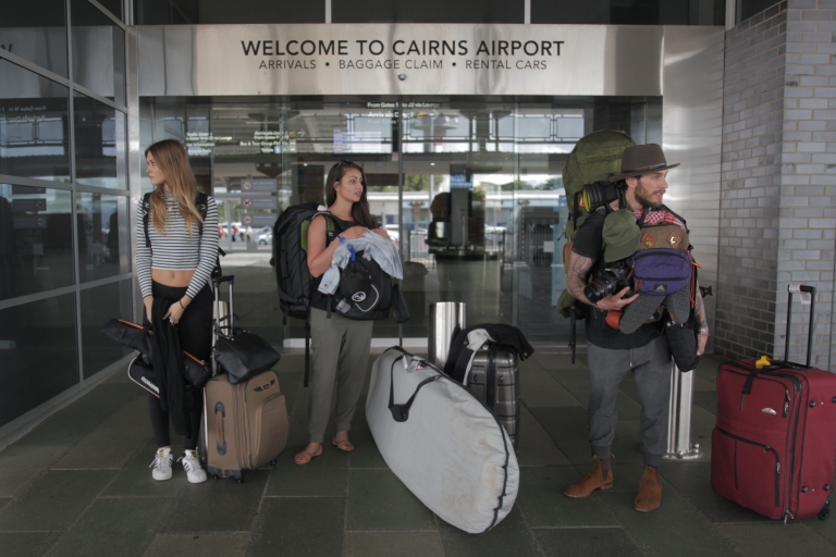 Tourists standing outside Cairns Airport, Cairns, Queensland © Hostels Australia