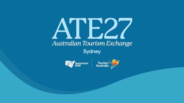 The official digital tile for ATE27, the Australian Tourism Exchange, held in Sydney. The light blue text and logos for Destination NSW and Tourism Australia are set against a vibrant blue background with curved wave patterns. © Tourism Australia
