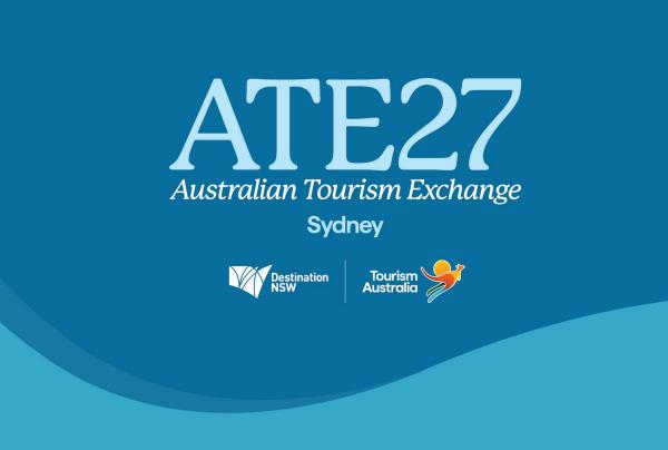 The official digital tile for ATE27, the Australian Tourism Exchange, held in Sydney. The light blue text and logos for Destination NSW and Tourism Australia are set against a vibrant blue background with curved wave patterns.