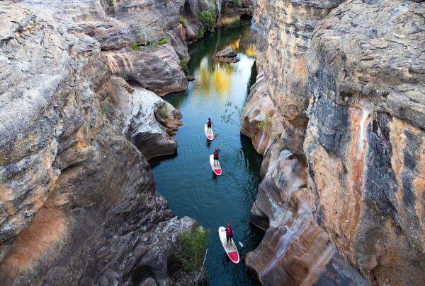 Stand-up paddle boarding in Cobbold Gorge, Forsayth, Queensland © Tourism and Events Queensland