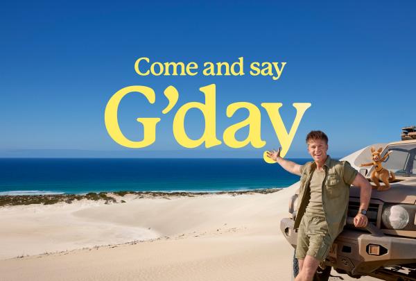 Come and say G'day, Robert Irwin leaning against a 4WD on the beach in Port Lincoln, South Australia © Tourism Australia