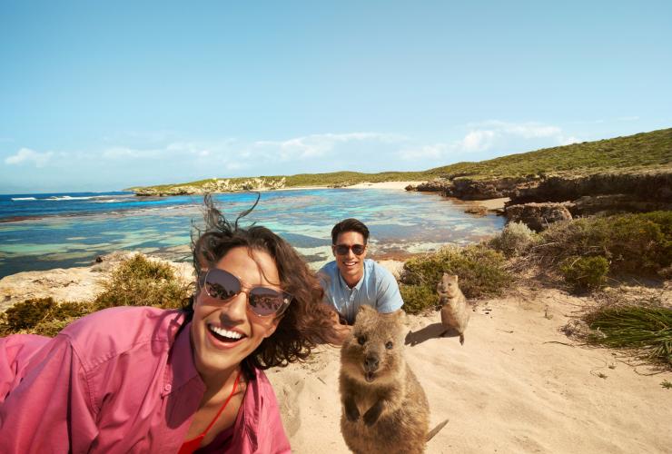 Couple posing with quokkas on the beach on Rottnest Island, Western Australia © Georges Antoni Couple posing with quokkas on the beach on Rottnest Island, Western Australia © Georges Antoni