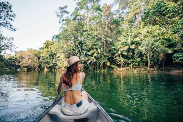Woman kayaking at Silky Oaks Lodge, Mossman, Queensland © Tourism and Events Queensland